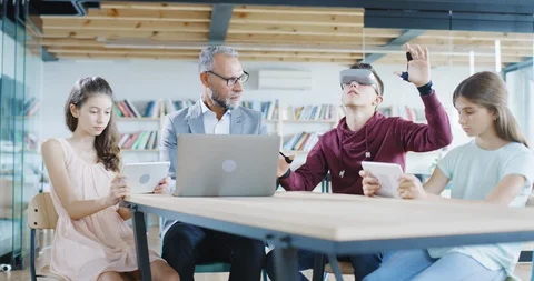 Children And Teacher Using Augmented Reality AR Glass In A Classroom New Tech Stock Footage 100734168