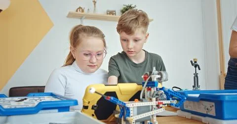 Children Are Actively Engaged in Learning About Robotics Through Collaboration Stock Photos