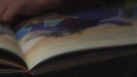 Children are considering a book . Blurred movie Stockbeeldmateriaal 101788855