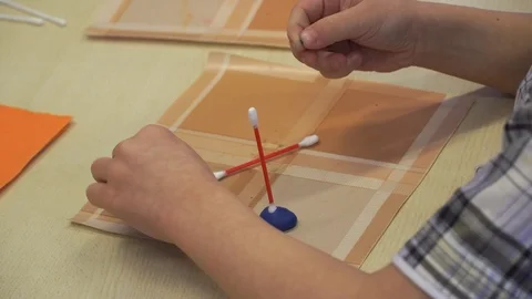 Children are engaged in creativity. Close-up of hands. Cotton buds with plastici Stock Footage 99730122