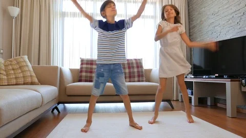 The children are having fun. The boy and the girl are having fun.  Stock Footage 77405162