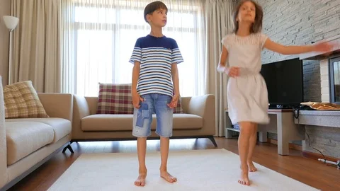 The children are having fun. The boy and the girl are having fun.  Video stock 77407229