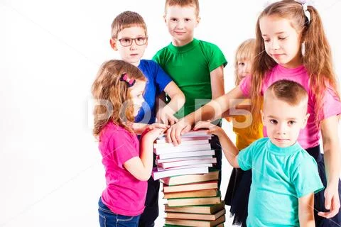 The children are interested in books Stock Photos