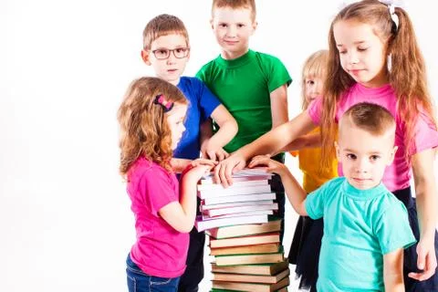 The children are interested in books Stock Photos