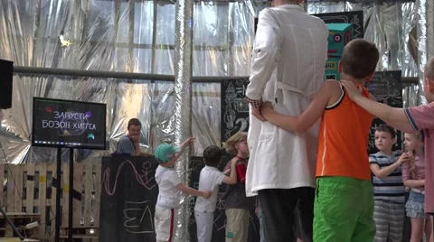 Children are introduced to the robots in the game. New technologies. Stock Footage 52362277