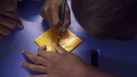 Children are learning to create origami in craft class in India Stock Footage 162077635