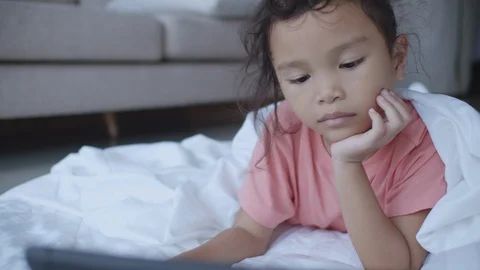 Children are learning by themselves through online media. Stock Footage 110620851