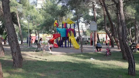 Children are playing and having fun on playground in the park Stock Footage 201112925