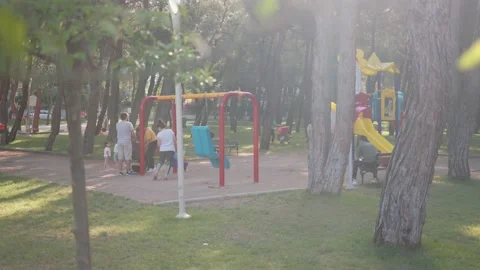 Children are playing and having fun on playground in the park Stock Footage 201216259
