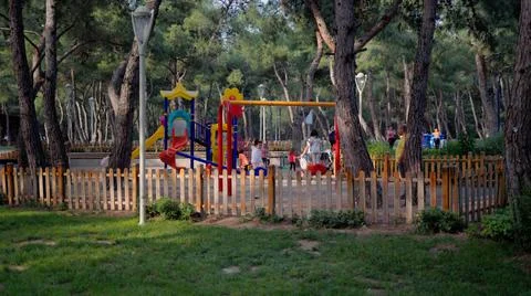 Children are playing and having fun on playground in the park Stock Photos