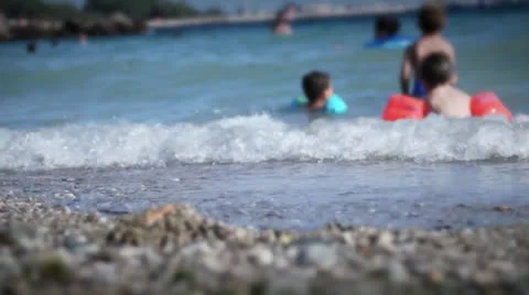 Children are playing on the beach Stock Footage 25405478