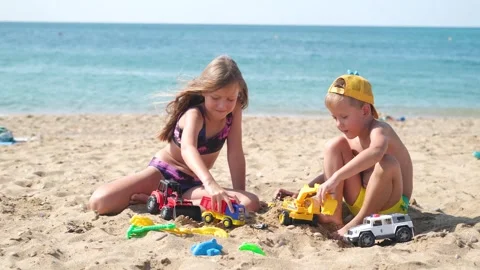 Children are playing on the beach. Stock Footage 277534372