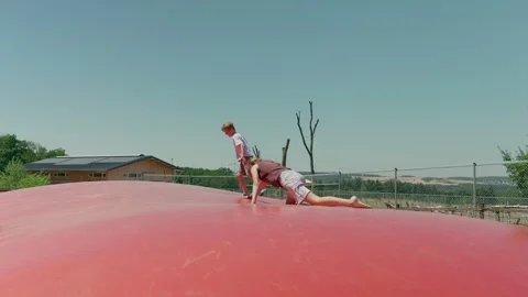 Children are Playing on the Trampoline 스톡 동영상 344290069