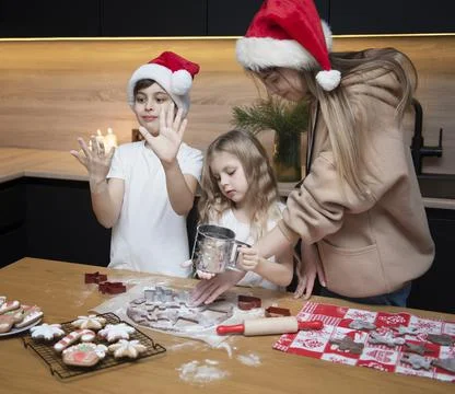 Children are preparing gingerbread in the kitchen Stock Photos