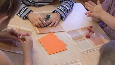 Children are purposefully engaged in creativity. Good classes are held in kinder Stock Footage 99730434