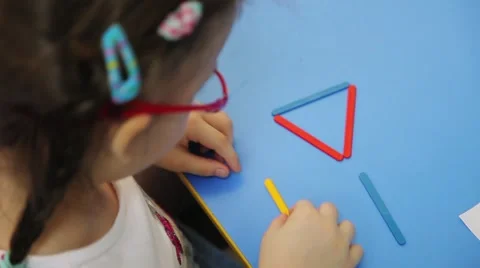 Children are taught to count using counting sticks Stock Footage 53747447