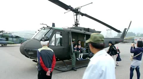 Children in an army helicopter Stock Footage 8926151