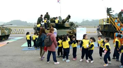 Children on army tank Video stock 8924683
