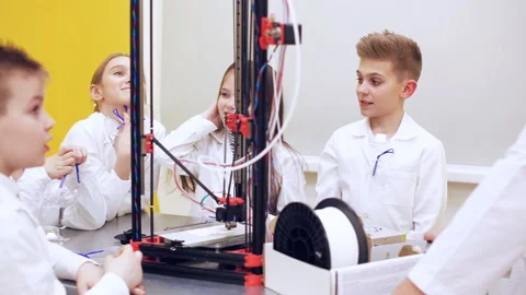 Children around 3D printer study modern technology Stock Footage 87166299