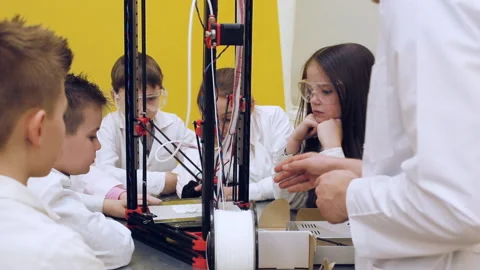 Children around 3D printer study modern technology Stock Footage 88267266