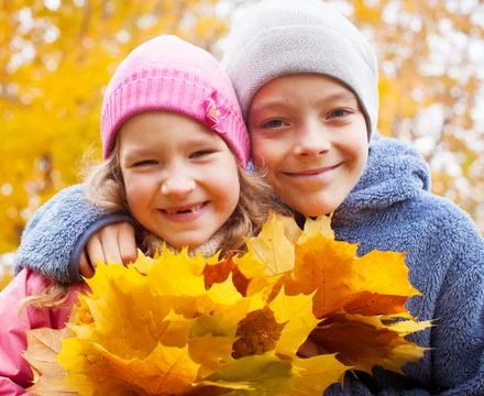 Children at autumn Stock Photos