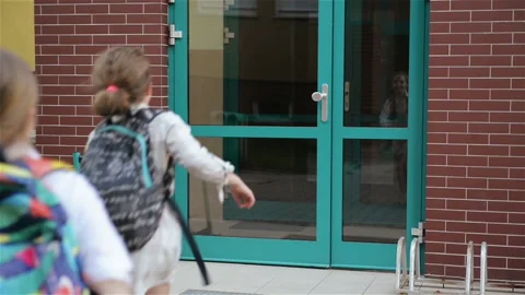 Children With Backpacks Running To School. Two Boys And Two Girls Are Returning Stock Footage 111574615