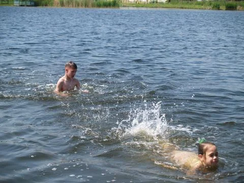 Children bathe in the river Stock Photos