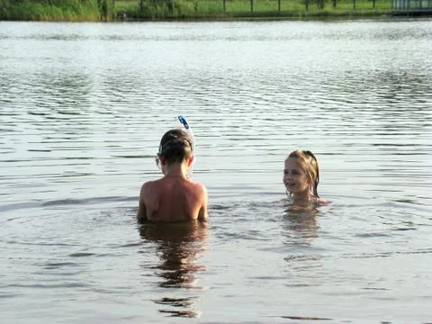 Children bathing in the river Stock Photos