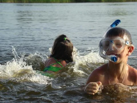 Children bathing in the river Stock Photos