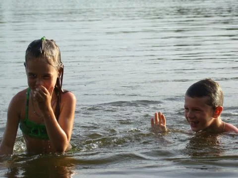 Children bathing in the river Stock Photos