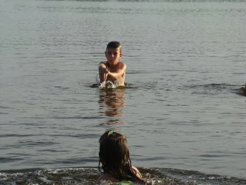 Children bathing in the river Stock Photos