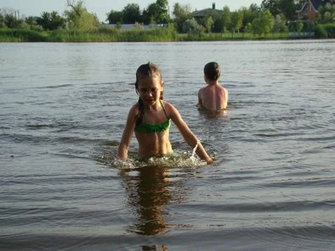 Children bathing in the river Stock Photos
