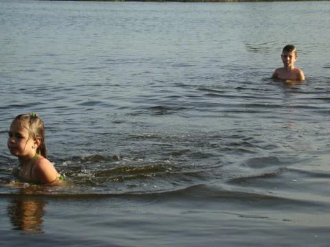 Children bathing in the river Stock Photos