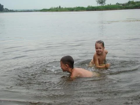 Children bathing in the river Stock Photos
