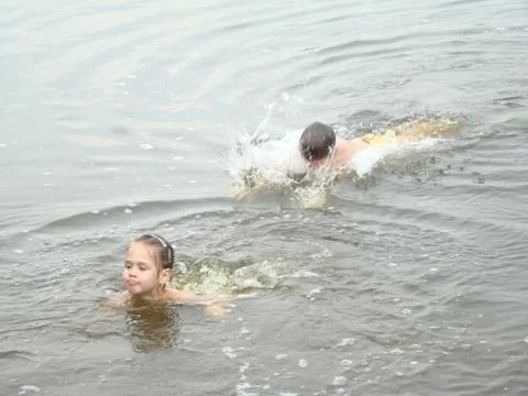 Children bathing in the river Stock Photos