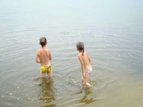 Children bathing in the river Stock Photos