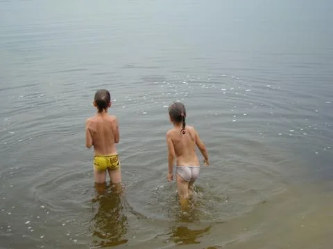 Children bathing in the river Stock Photos