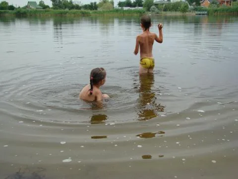 Children bathing in the river Stock Photos