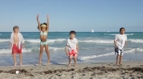 Children at the beach randomly jumping Stock Footage 22233040