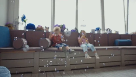 Children blowing soap bubbles and having fun. Stock Footage 73683662