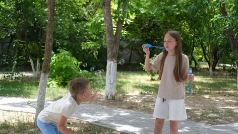 A children blows soap bubbles. Stock Footage 302800144