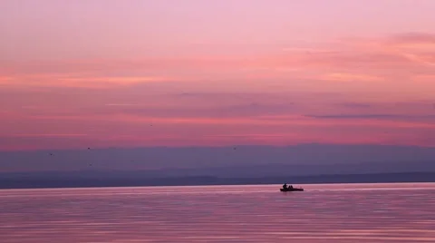 Children on a boat on a lake sunset Stock Footage