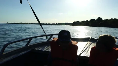 Children in a boat on a river Video stock 84660357