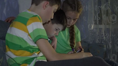 Children Boys playing with the tablet Stock Footage 78558439