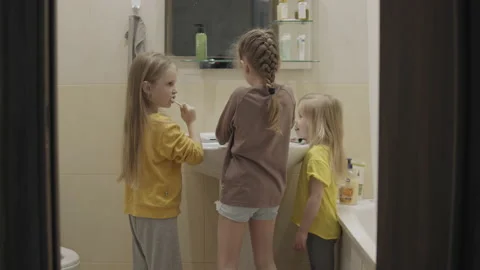 Children brush their teeth Stock Footage 154602336