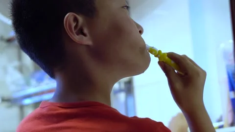 Children brush their teeth to protect their teeth and prevent oral diseases Stock Footage 164633582