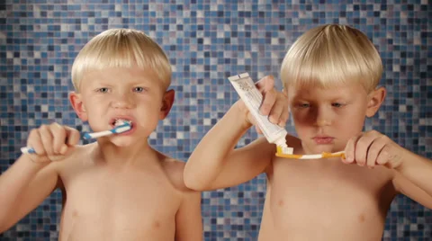 Children brushing teeth Stock Footage 32648415