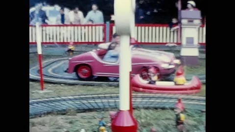 Children on the carousel at the playground in the 60's Stock Footage 205592828
