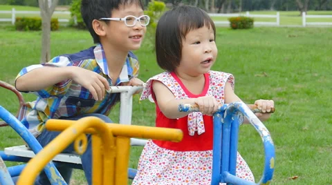 Children on the carousel at the playground Stock Footage 54089170