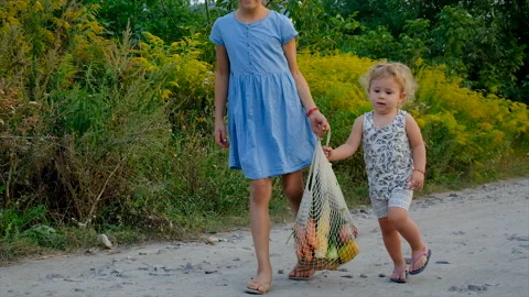 Children carry vegetables in a bag. Selective focus. Stock Footage 213990974